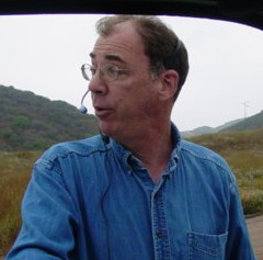 Billy Burke on the phone talking about realtorauction.com